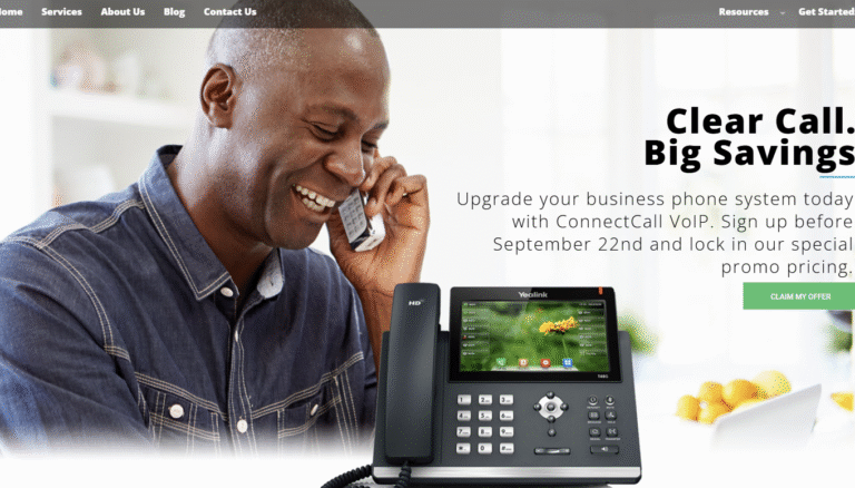 Man smiling while using a VoIP phone system, promoting ConnectCall services for business phone upgrades.